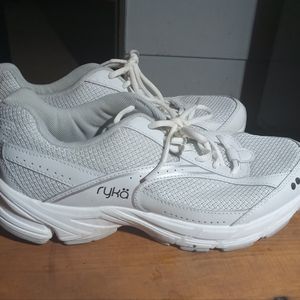 White Ryko tennis shoes.